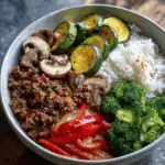 Spicy Ground Beef Stir-Fry Bowl with Garlic Veggies & Steamy Rice